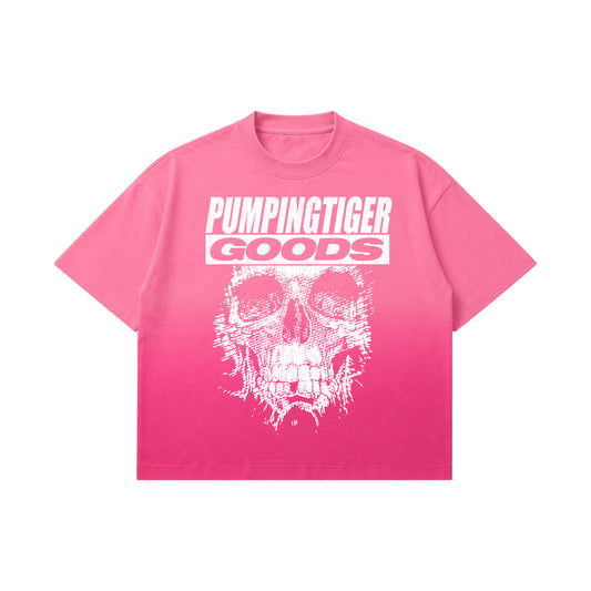 PUMPINGTIGER Skull Graphic Pink Sunfade Ombre Washed Boxy Fit T-Shirt front view featuring a distressed skull graphic on a pink sunfade ombre washed boxy fit t-shirt.